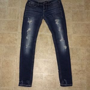 Buckle distressed skinny jean